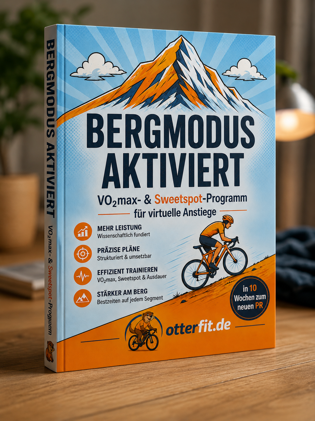Buchcover "Bergmodus aktiviert" mit Fahrradfahrer und Bergen im Hintergrund.